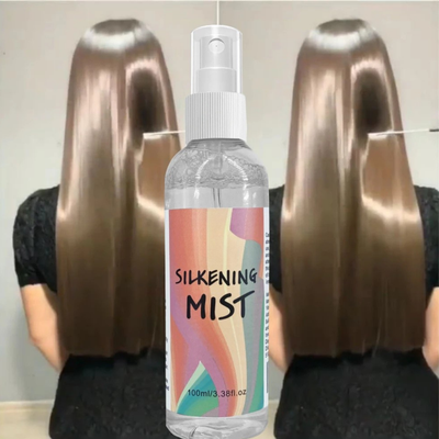 Model holding Silkening Mist Heat Protectant Spray
